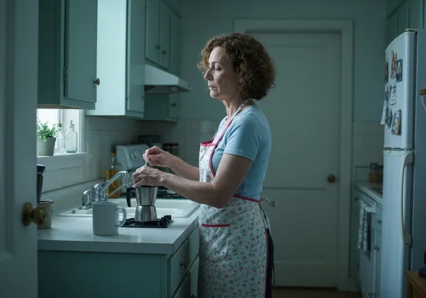 Person on autopilot, making coffee, looking disengaged
